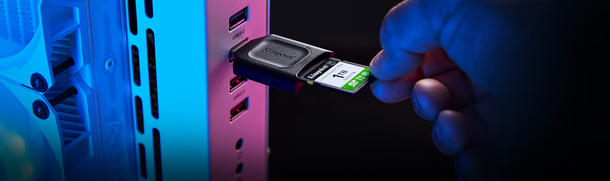 A Canvas Select Plus SD card being inserted into an SD reader, connected to a PC