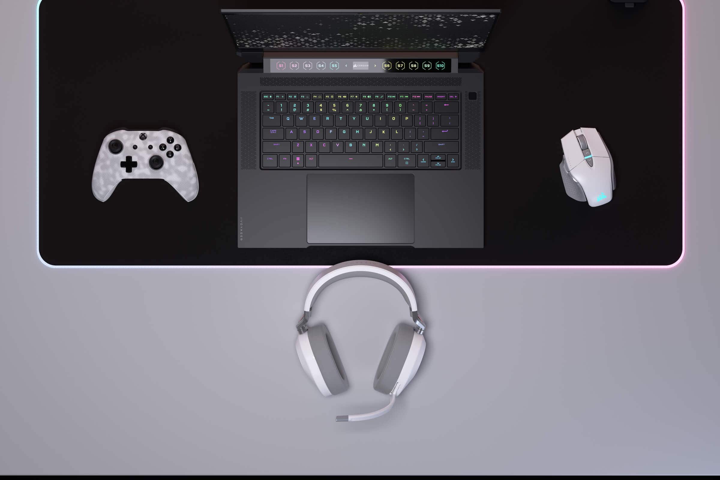 Top-down shot of the HS65 WIRELESS headset on a table with gaming gear.